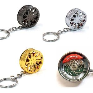llavero metálico llanta multirayada con disco de freno giratorio en colores plata, dorado y negro